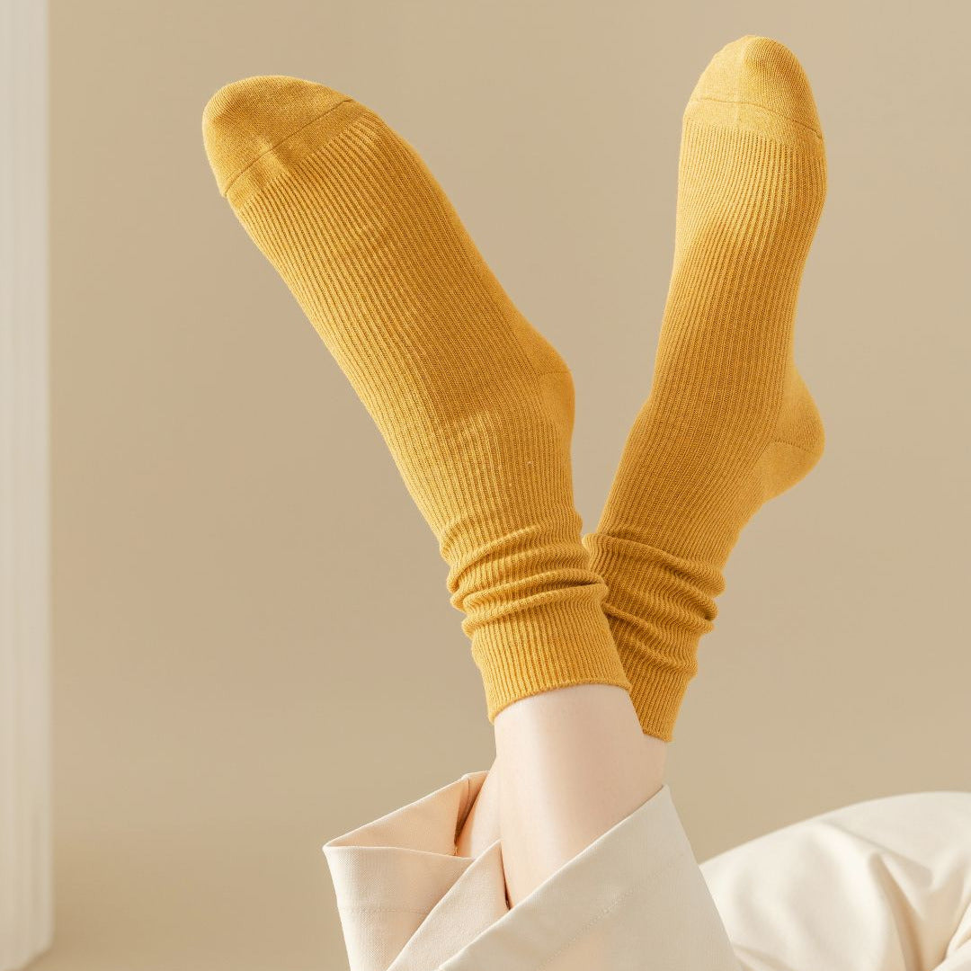 Yellow socks worn with a neutral background