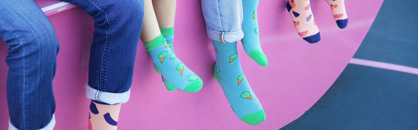A family wearing colorful KOFORA socks