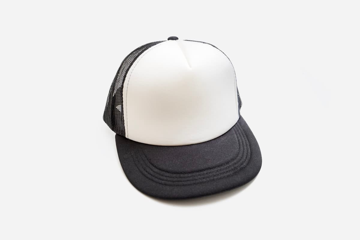 Black and white trucker cap on white background